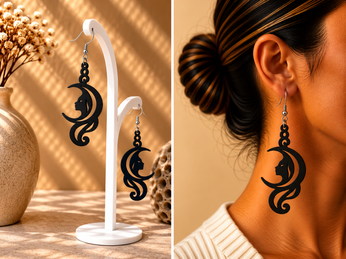Boucles d’oreilles noires au motif de croissant de lune et profil de sorcière ajouré, présentées sur support et portées