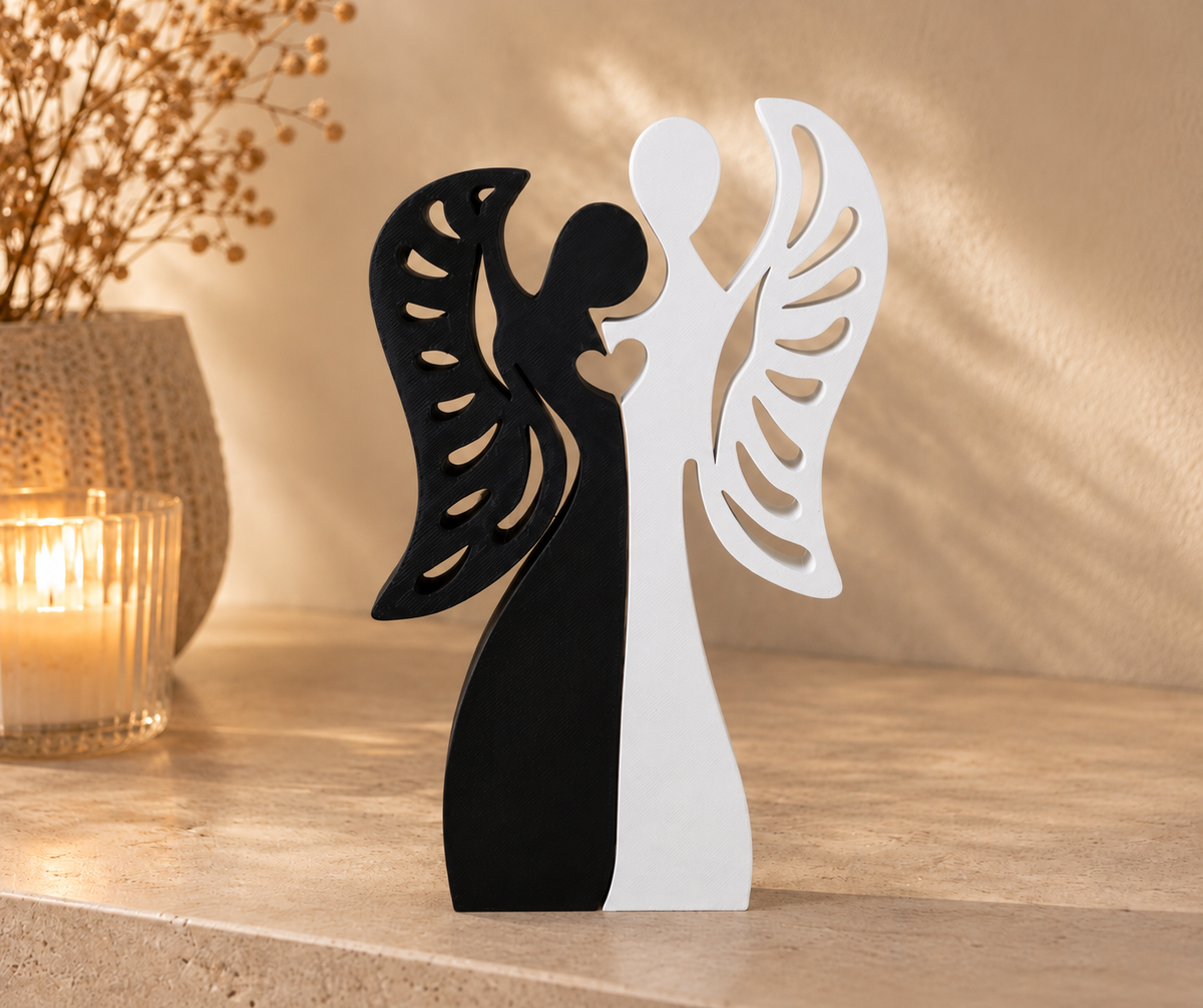 Deux silhouettes ailées décoratives noire et blanche, à poser côte à côte